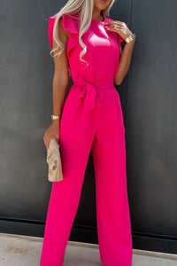 Bright pink round neck cap sleeve jumpsuit with tied waist detail, perfect for stylish summer outings.