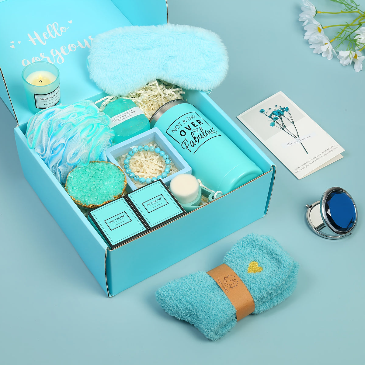 a blue box with a pair of sunglasses and a blue towel