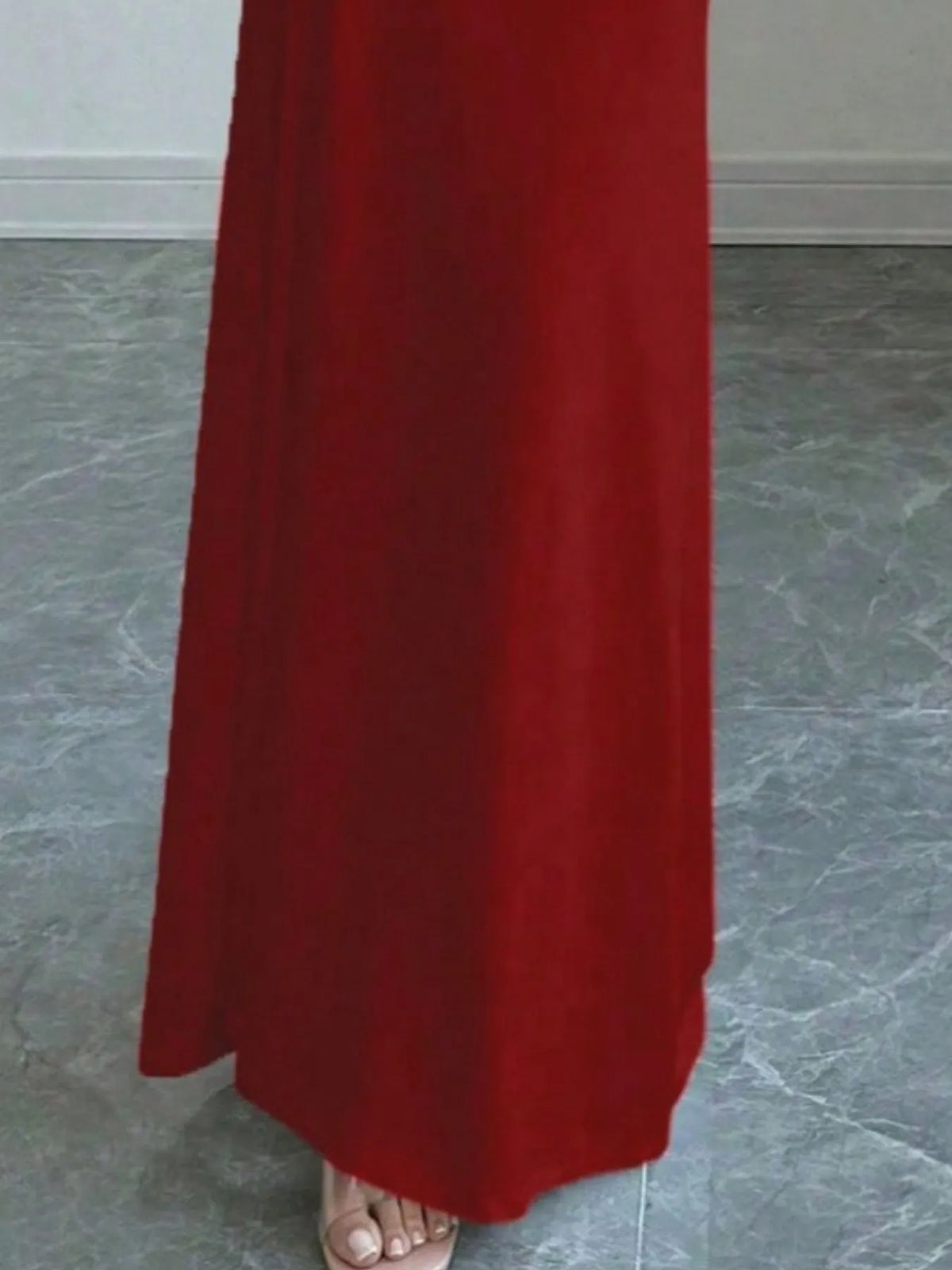 Close-up of a red off-shoulder long sleeve bodycon maxi dress, showcasing luxurious fabric perfect for weddings.