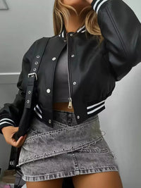 Model wearing a stylish black Snap Down Long Sleeve Jacket with striped cuffs, paired with a trendy skirt.