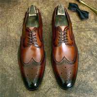 Genuine leather brogue business shoes in brown, featuring elegant detailing and a pointed toe for formal attire.