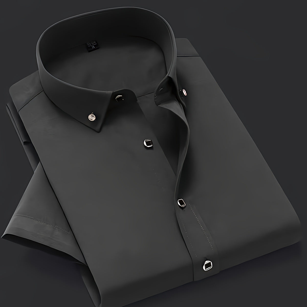 a black dress shirt on a black background