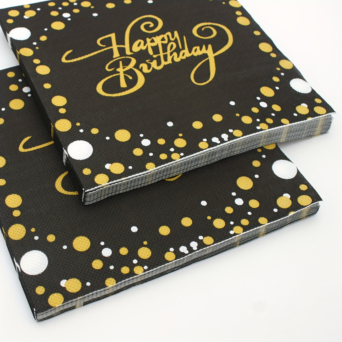 a black and gold dotted birthday book with a happy birthday written on it