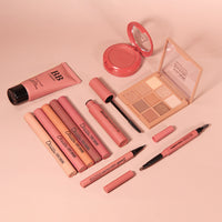 a collection of makeup and cosmetics items on a table