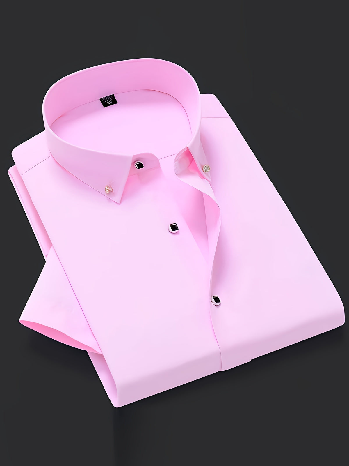 a pink dress shirt on a black background