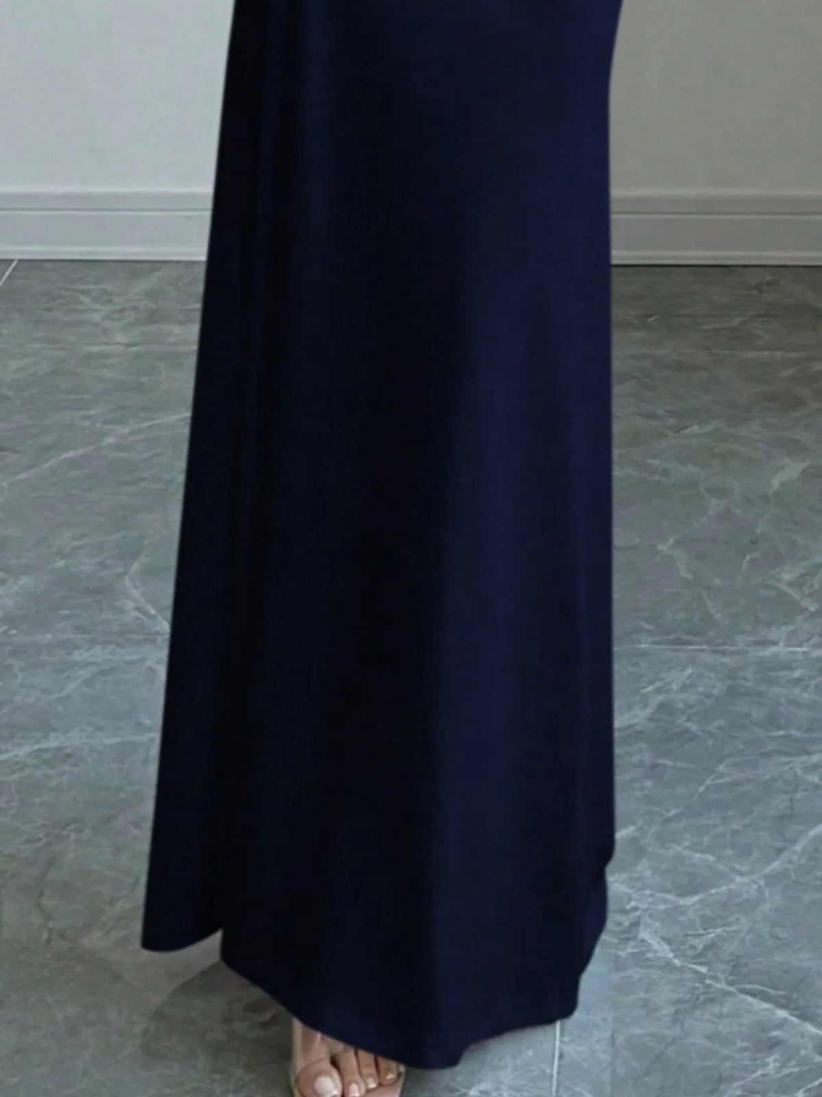 Close-up of the elegant navy blue off-shoulder long sleeve bodycon maxi dress, perfect for luxurious weddings.