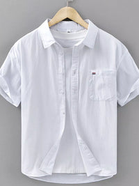 Men's white short sleeve button-up shirt with pocket, casual style, made of breathable cotton.