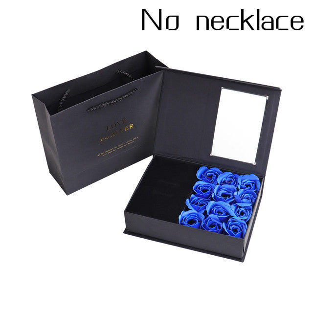 a black box with blue roses inside of it