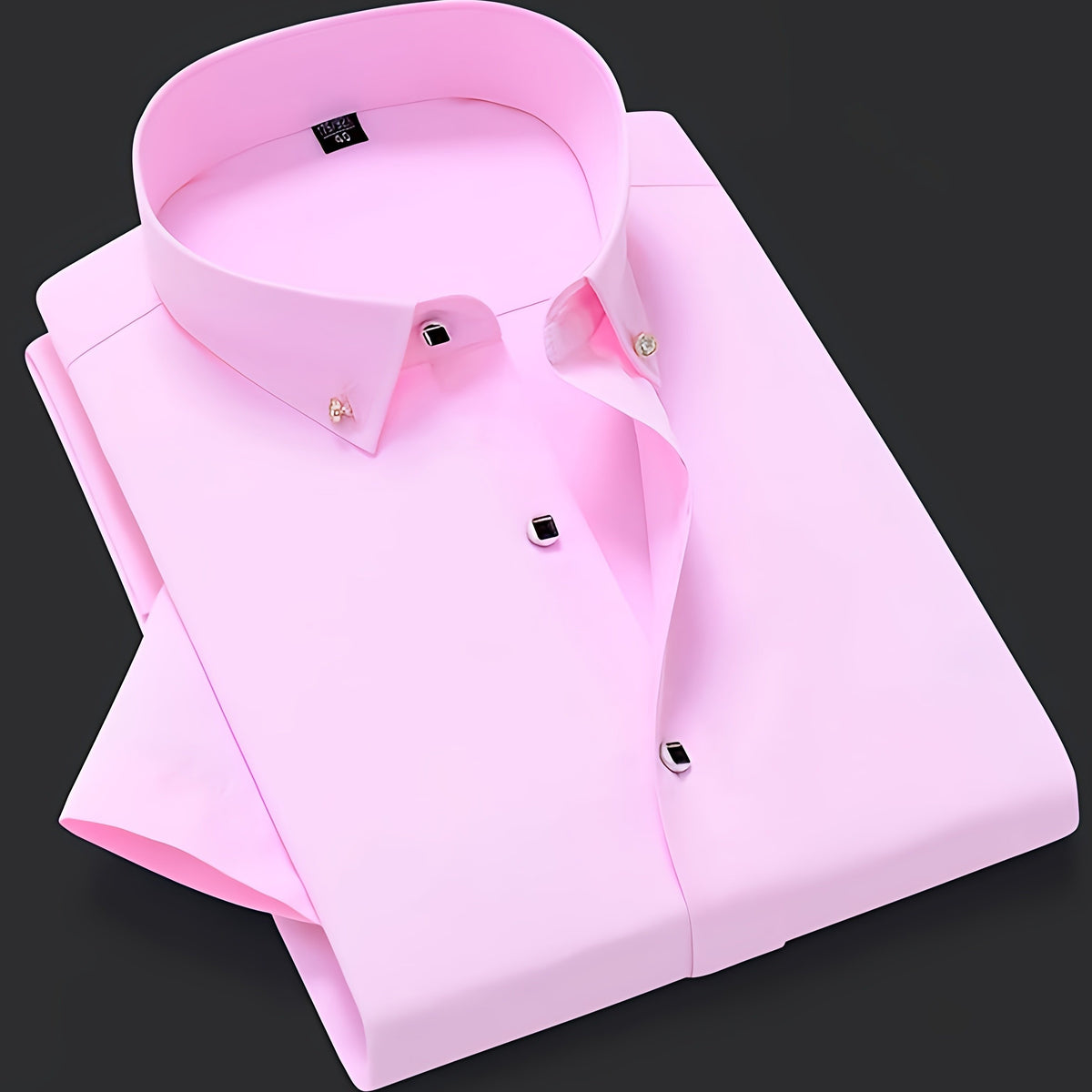 a pink dress shirt on a black background