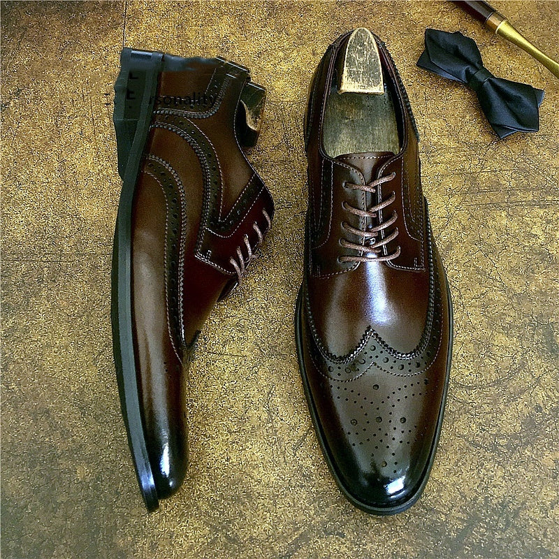 Genuine leather brogue business shoes in brown, featuring elegant brogue detailing and a sleek silhouette, perfect for formal occasions.