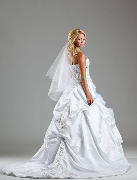 a beautiful bride in a wedding gown - luxurious weddings