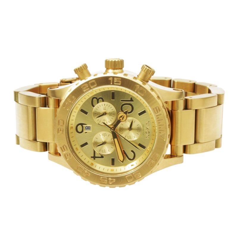 Nixon 42-20 Chrono Champagne Dial Gold Tone Men's Watch A037-502 displayed on a gold tone bracelet.