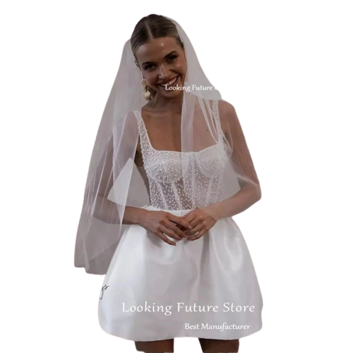 a woman wearing a white wedding dress and veil