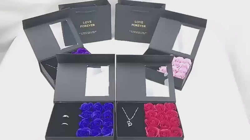 a group of four boxes with roses inside of them