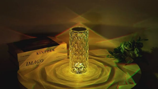 a glass vase sitting on top of a table