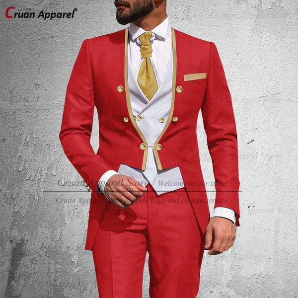 a man in a red suit and gold tie