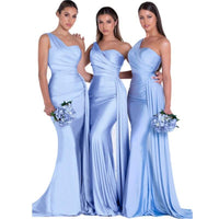 three women in blue dresses standing next to each other