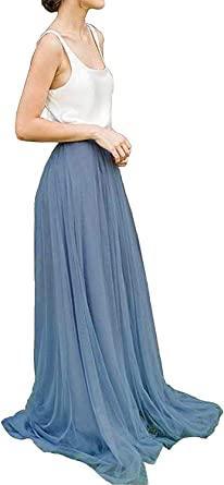a woman wearing a long blue skirt